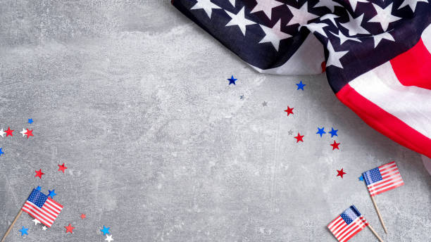 istock US American flags and confetti star on concrete stone background with copy space. Banner mockup for Presidents day, USA Memorial day, Veterans day, Labor day, or 4th of July celebration. 1198512660