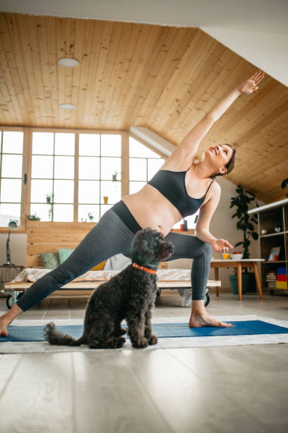 istock Pregnant woman practicing yoga 1198512731