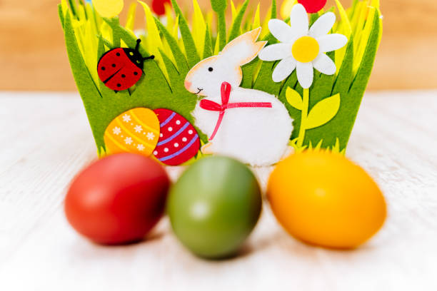 basket with painted colorful easter eggs easter egg hunt
