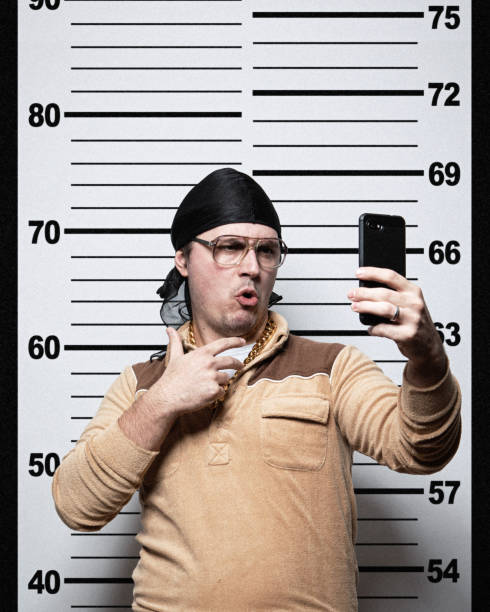 Police Lineup Mugshot Selfie Portraits Assorted portraits of people having their mug shot taken while being booked at the police department, but taking a self portrait at the same time with a happy smiling expression. do rag stock pictures, royalty-free photos & images