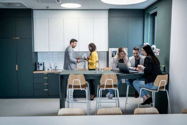 istock Colleagues taking a break in the cafeteria 1198516706