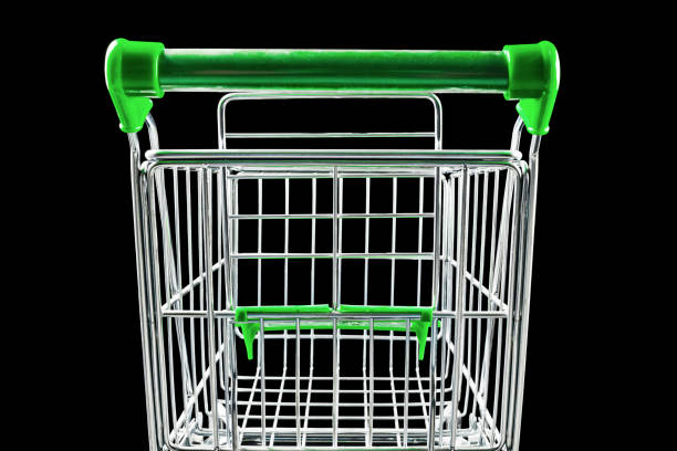Green shopping cart on a black background.