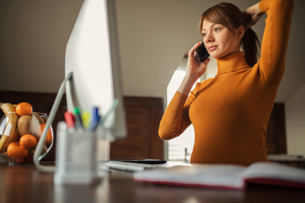 istock Young pregnant woman working on computer at home 1198521235
