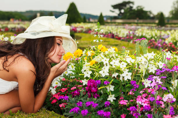 Beautiful young woman enjoying the gardens in a Parisian park.