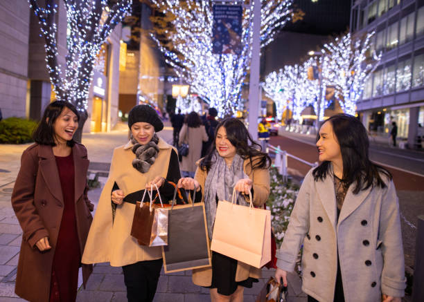 asian women walking on city street after shopping at christmas night - roppongi imagens e fotografias de stock