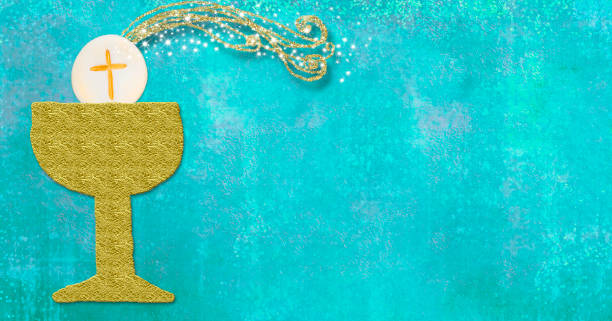 istock First holy communion invitation card. Gold chalice and host on  blue paper 1198524416