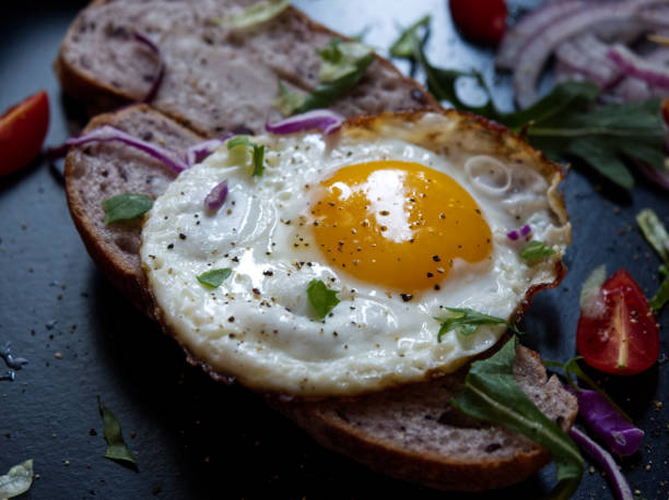 istock A good food, fried eggs with bread slices, vegetables and bacon rolls. 1198526273