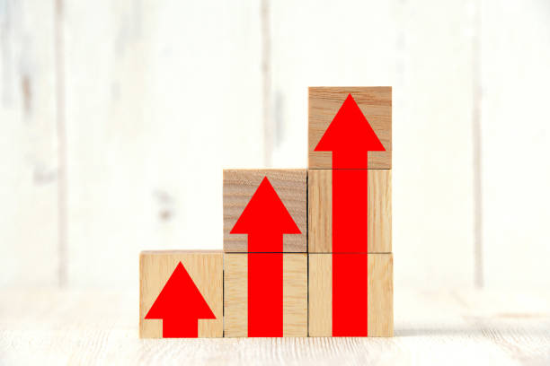 istock Rising arrows painted on wooden blocks 1198526370