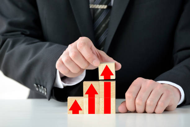 istock Rising arrows painted on wooden blocks 1198527110