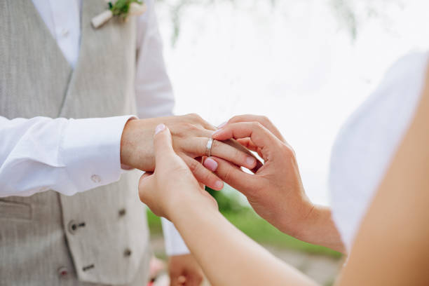 istock wedding ring put finger tradition family love 1198532361