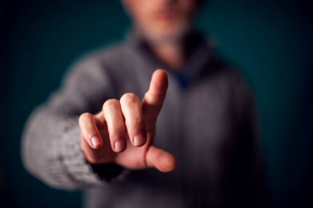istock Businessman in suit pressing virtual button or pointing at something 1198533664