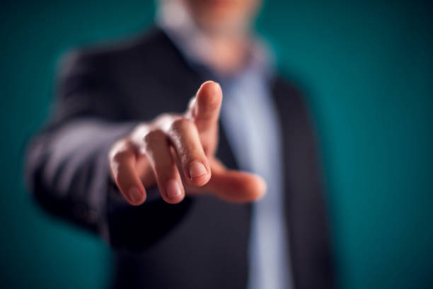 istock Businessman in suit pressing virtual button or pointing at something 1198533676