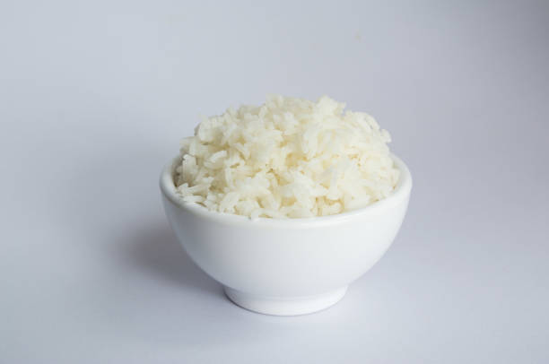 istock Jasmine rice in bowl on white background 1198541117