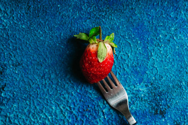 istock Ripe and juicy strawberry on the dark rustic background 1198552713