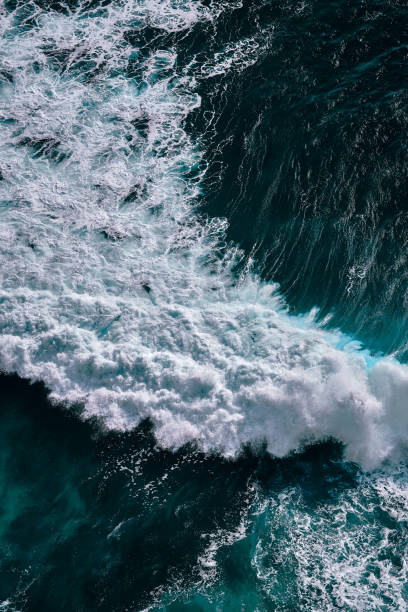 istock Aerial view to seething waves with foam. 1198556156