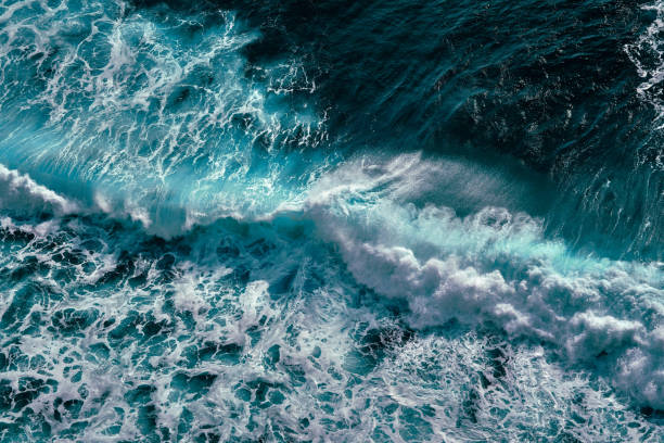 istock Aerial view to ocean waves. Blue water background 1198556191