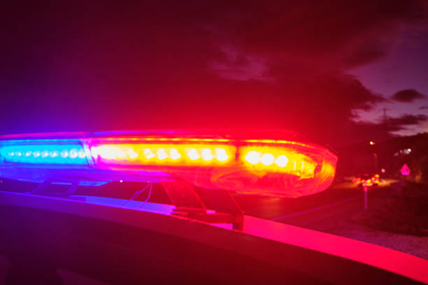 istock police car flashing lights in the night selective focus 1198560609