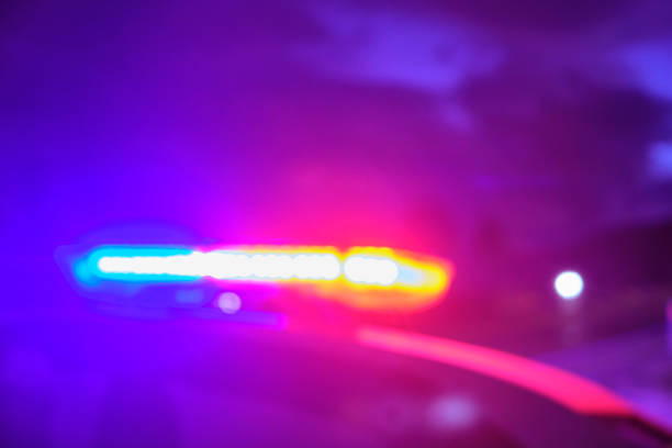 istock police car flashing lights in the night blurred selective focus 1198561267