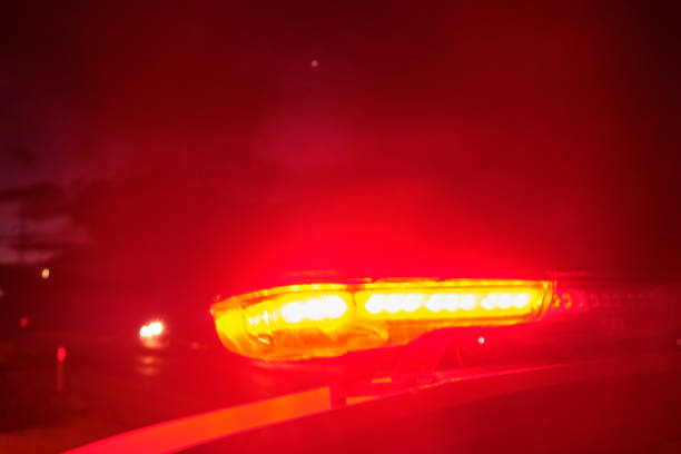 istock police car flashing lights in the night selective focus 1198561269