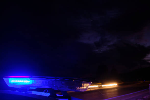 istock police car flashing lights in the night selective focus 1198561273