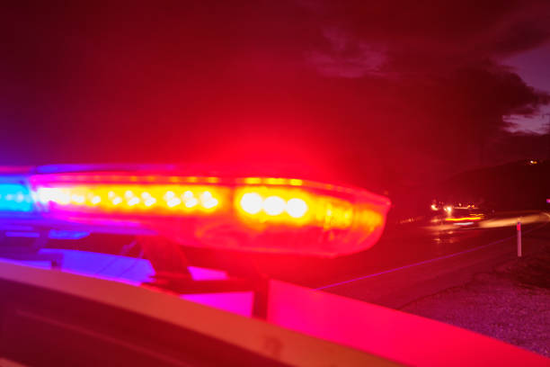 istock police car flashing lights in the night selective focus 1198561332