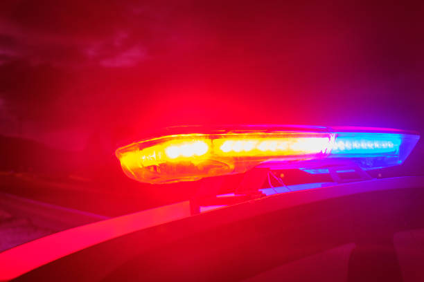 istock police car flashing lights in the night selective focus 1198561342