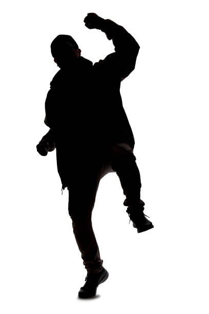 istock Silhouette of a Male Hiker or Explorer Doing Happy Gestures 1198562577
