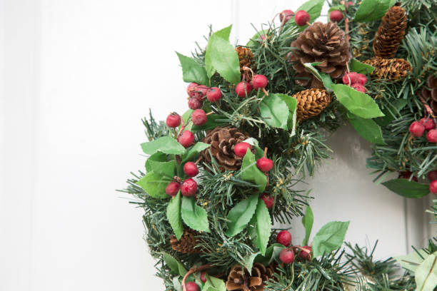 istock Natural Green Christmas Wreath on Door 1198570574