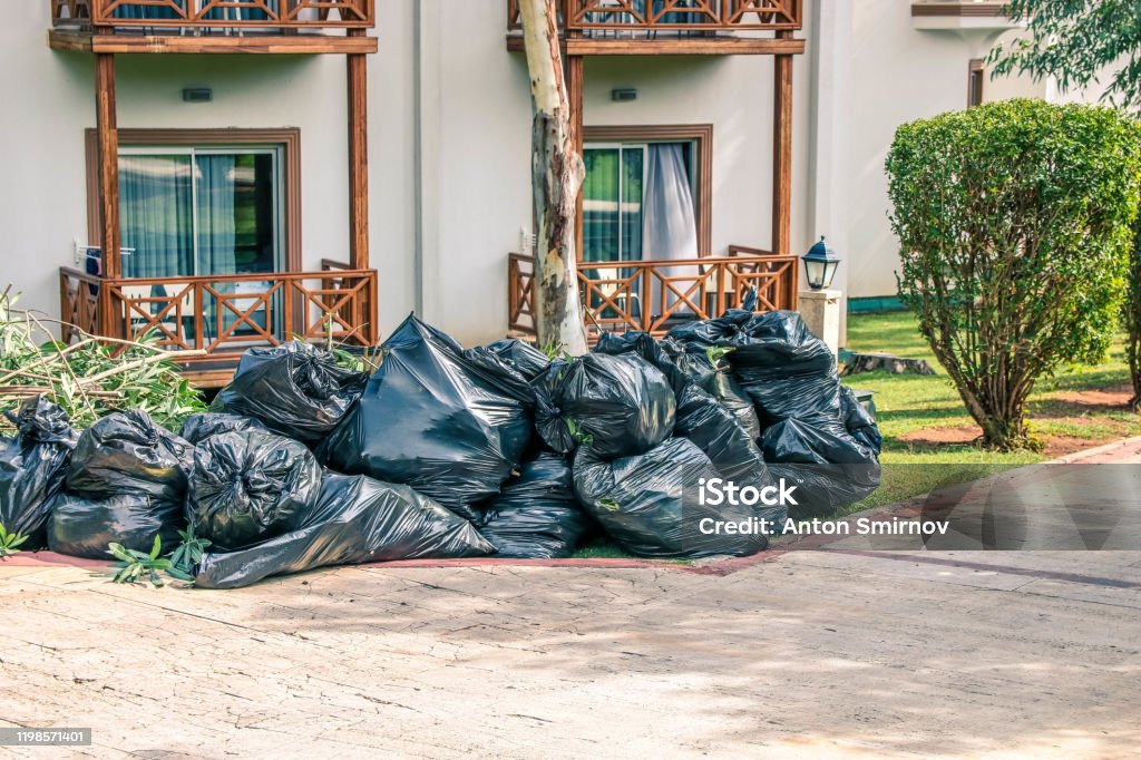 https://media.istockphoto.com/id/1198571401/photo/pile-of-black-garbage-in-bags-near-the-road-in-the-city-pollution-trash-black-garbage-bag.jpg?s=1024x1024&w=is&k=20&c=OQ_8h5Ub8VBgz0pDFtWiXdFV20KLF0AFYEcqkz-x7FA=