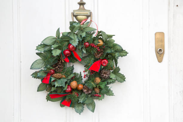 istock Christmas Wreath on White Front Door 1198571640
