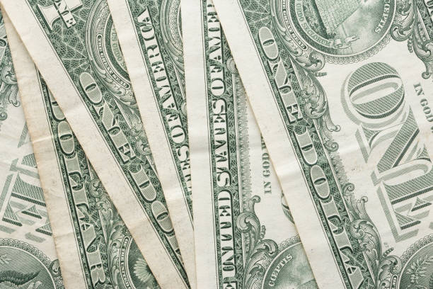 istock One Dollar Paper Currency Dollar Banknotes. 1198572803