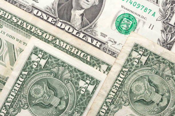 istock One Dollar Paper Currency Dollar Banknotes. 1198573046