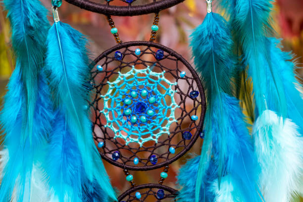 istock Handmade dream catcher with feathers threads and beads rope hanging 1198574832