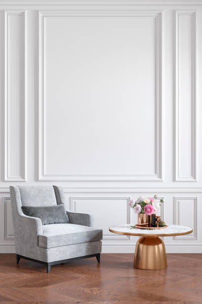 istock Classic white interior with gray armchair, coffee table, flowers and wall moldings. 3d render illustration mockup. 1198575859