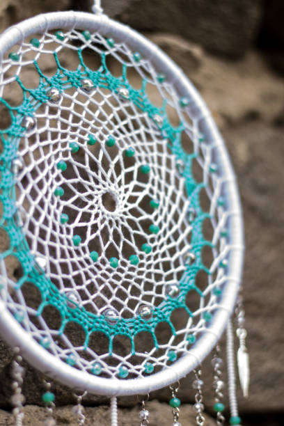 istock Handmade dream catcher with feathers threads and beads rope hanging 1198575960