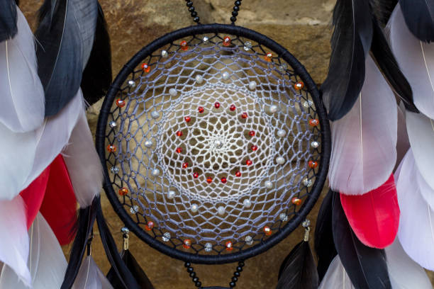 istock Handmade dream catcher with feathers threads and beads rope hanging 1198575975
