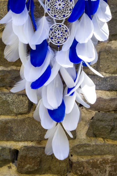 istock Handmade dream catcher with feathers threads and beads rope hanging 1198576039