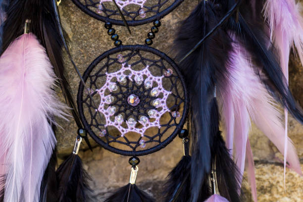 istock Handmade dream catcher with feathers threads and beads rope hanging 1198576084
