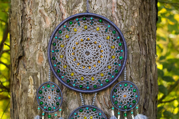 istock Handmade dream catcher with feathers threads and beads rope hanging 1198576442