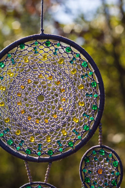 istock Handmade dream catcher with feathers threads and beads rope hanging 1198576484