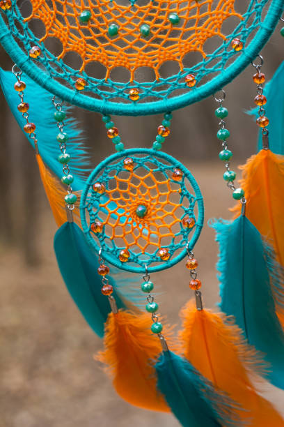 istock Handmade dream catcher with feathers threads and beads rope hanging 1198576518
