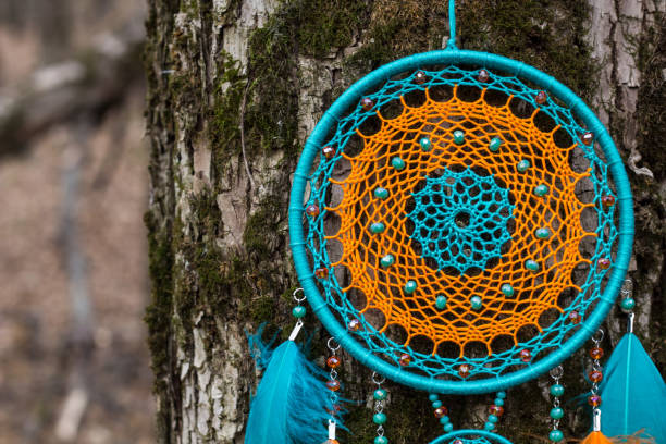 istock Handmade dream catcher with feathers threads and beads rope hanging 1198576523