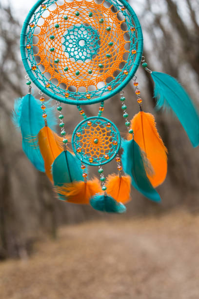 istock Handmade dream catcher with feathers threads and beads rope hanging 1198576530