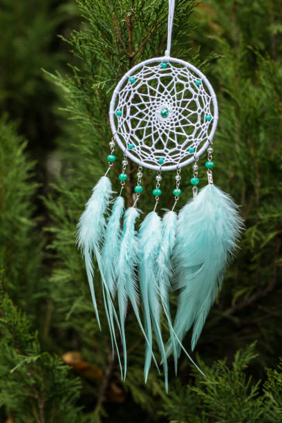 istock Handmade dream catcher with feathers threads and beads rope hanging 1198576662