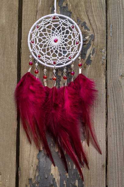 istock Handmade dream catcher with feathers threads and beads rope hanging 1198576674