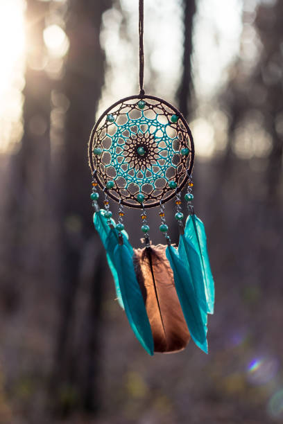 istock Handmade dream catcher with feathers threads and beads rope hanging 1198576692