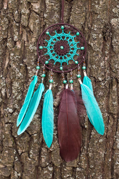 istock Handmade dream catcher with feathers threads and beads rope hanging 1198576698