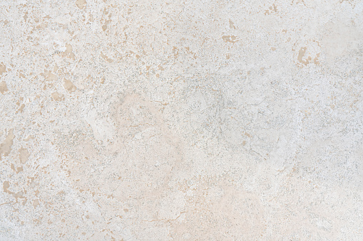 Beige limestone similar to marble natural surface for bathroom or kitchen countertop. High resolution texture and pattern.