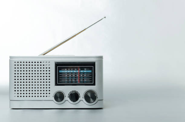 istock Grey colored retro radio on the silver background.Empty space for text 1198577636