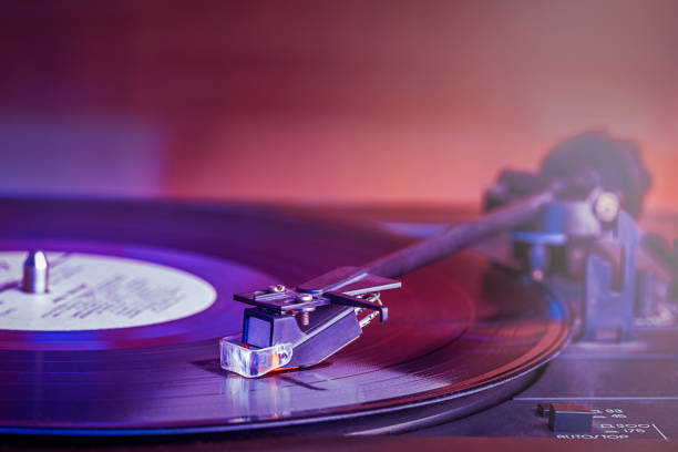 Vinyl record over purple background. Horizontal composition with copy space.